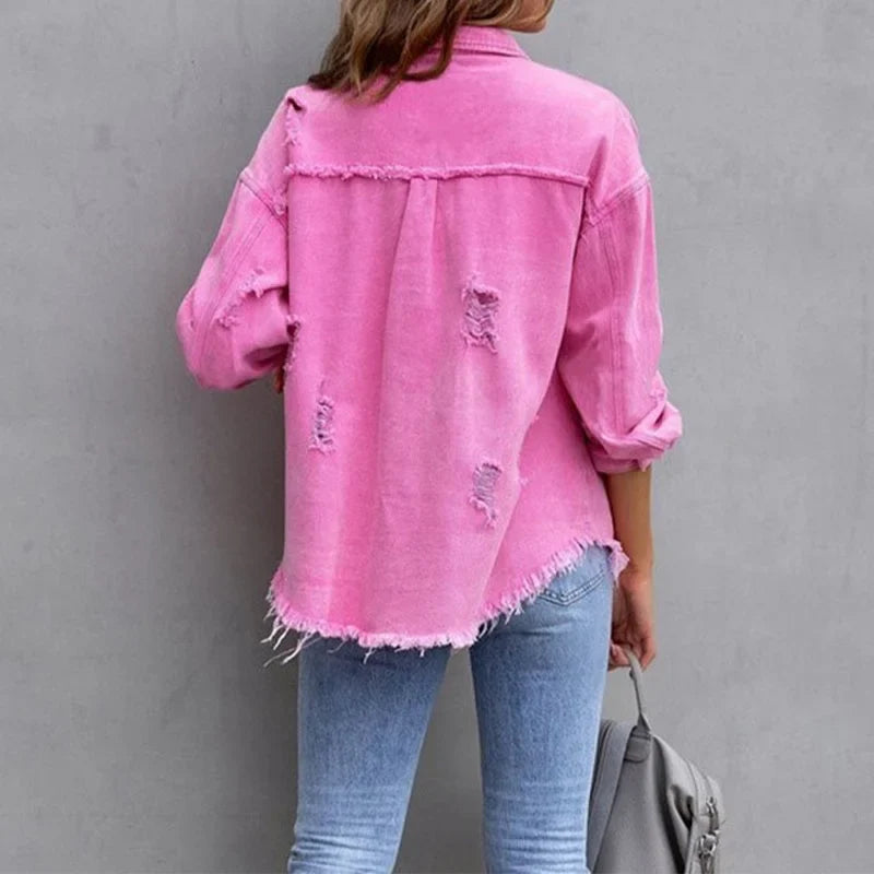 Versatile women's distressed jean jacket. Frayed hem, button-front, perfect layering piece.