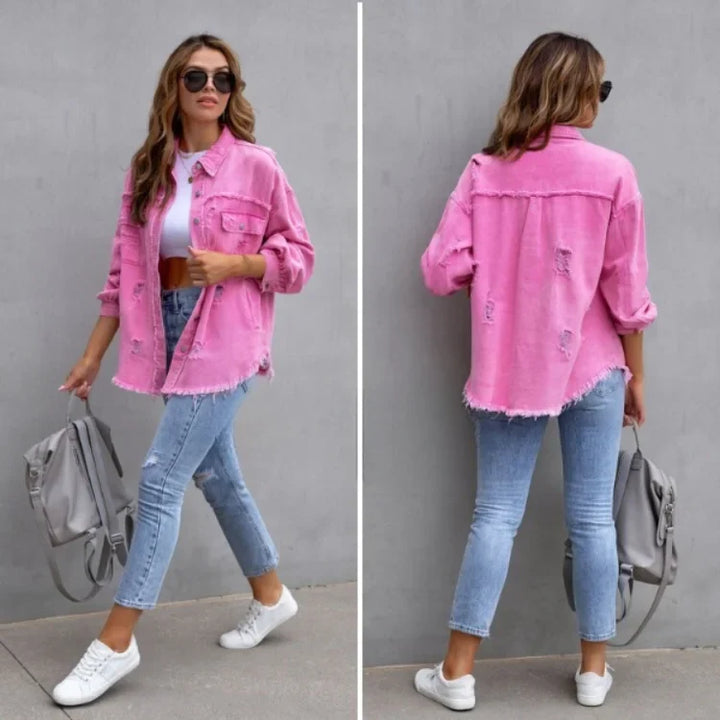 Stylish women's vintage-style distressed denim jacket. Features button front & trendy frayed hem.