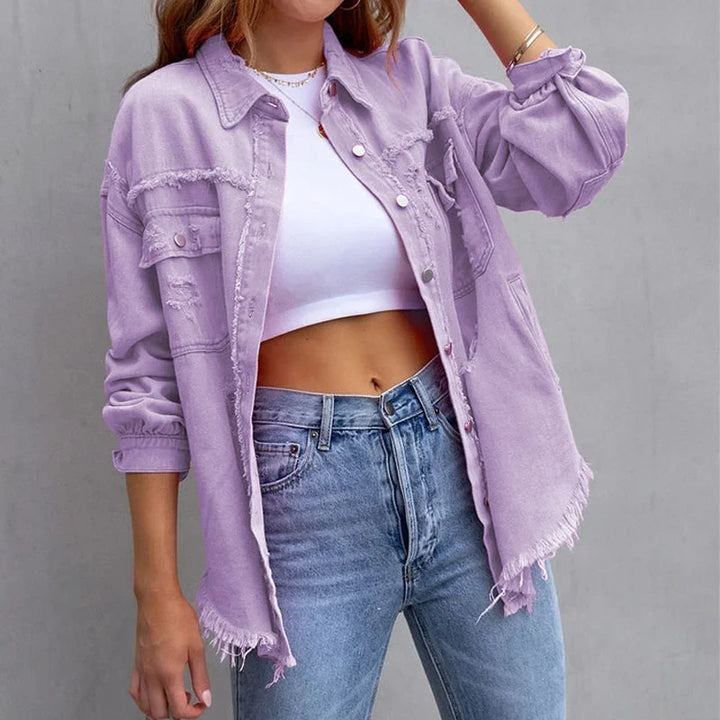 Modern vintage-style women's distressed jacket. Button-front denim with a chic frayed hem, versatile.