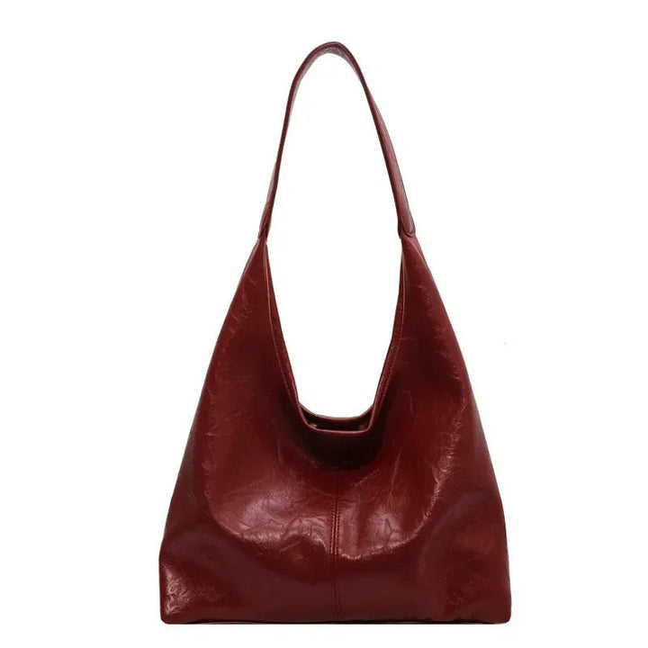 Versatile women's distressed leather tote, perfect as a shoulder bag with magnetic closure.