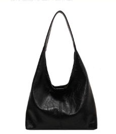 Classic distressed leather handbag for women, a spacious tote with convenient magnetic closure.