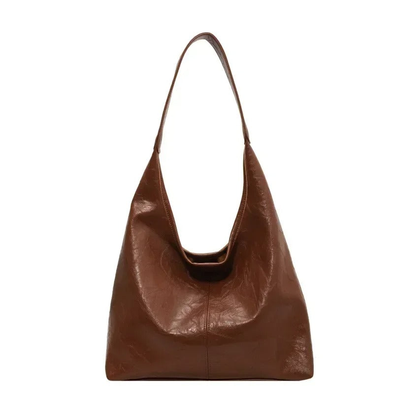 Everyday distressed leather tote bag for women, featuring a practical magnetic closure.