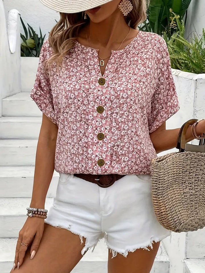 Women's ditsy floral button-front blouse with short sleeves and a relaxed fit, perfect for casual spring fashion.