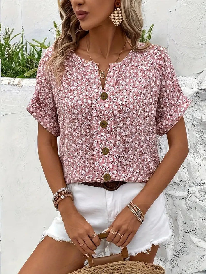 Relaxed fit women's ditsy floral short sleeve blouse, a stylish button-front summer top for everyday wear.