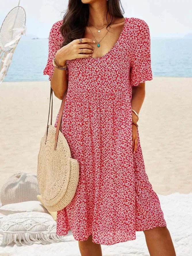 Women's ditsy floral V-neck mini dress with flutter sleeves, perfect for summer casual wear.