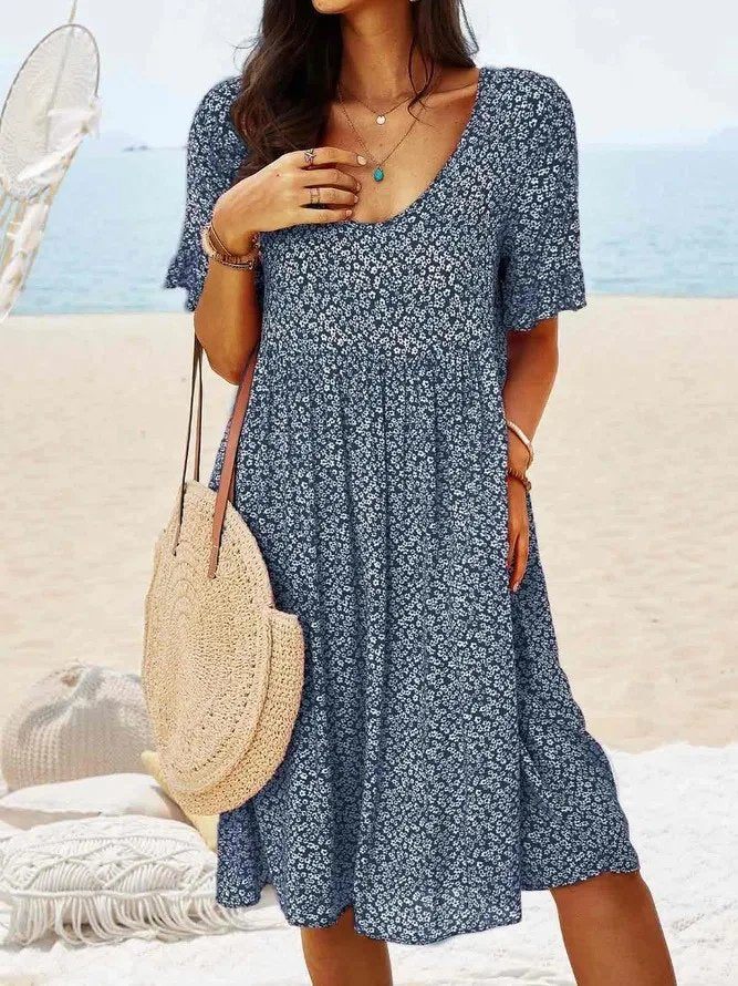 Elegant ditsy floral V-neck mini dress for women, featuring a flattering A-line cut and delicate flutter sleeves.