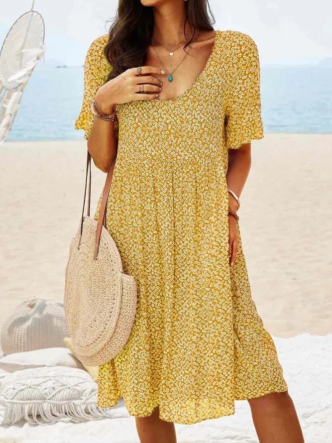 Cute women's ditsy floral mini dress with V-neck and flutter sleeves, great for spring and summer fashion.