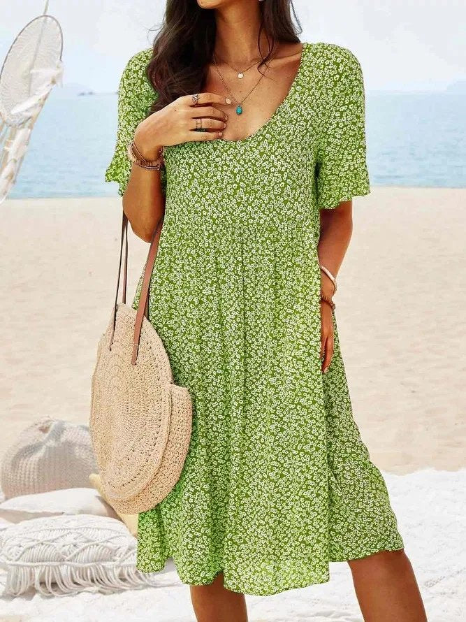 Light and airy women's ditsy floral flutter sleeve mini dress with a V-neck, suitable for holiday or casual outfits.