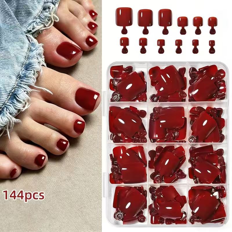 Full display of the 144-piece DIY nail art kit components: decals, stickers & tools for elegant home manicures.