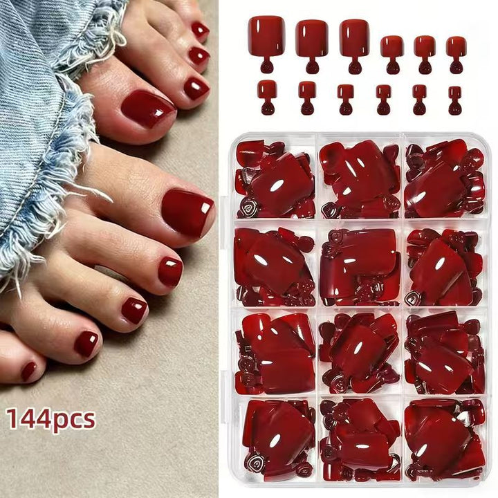 Full display of the 144-piece DIY nail art kit components: decals, stickers & tools for elegant home manicures.
