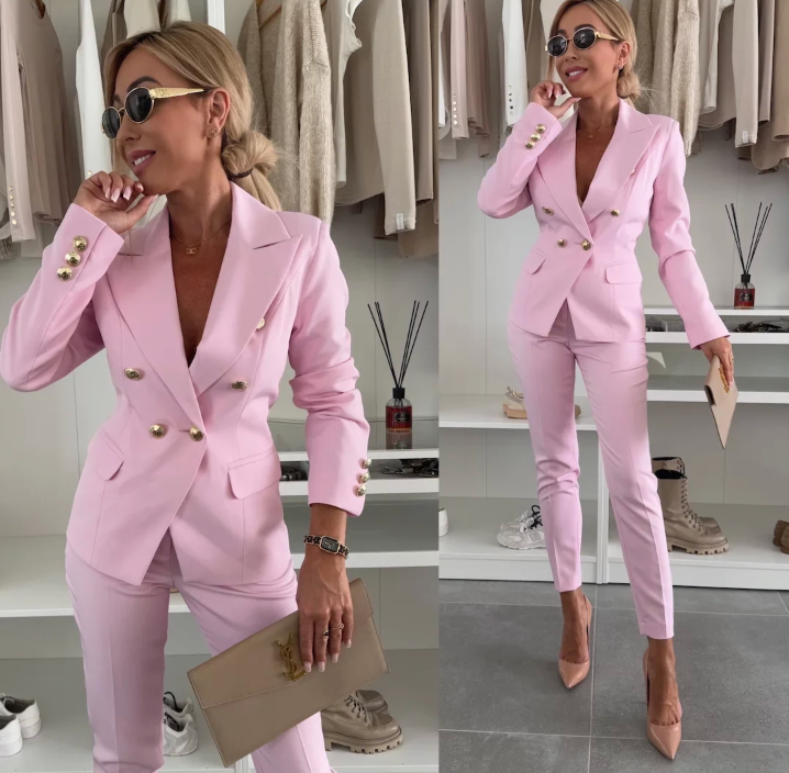 Women's double-breasted tailored blazer & slim trousers suit set. Professional business attire.