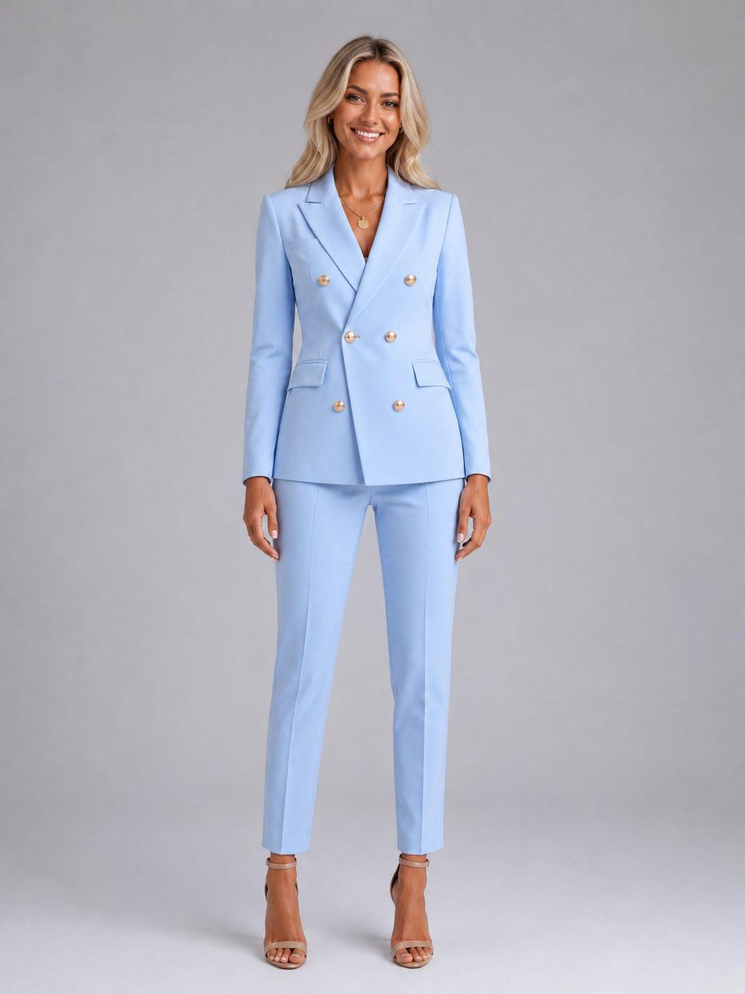 Women's double-breasted tailored blazer & trousers set. Professional, elegant workwear for business attire.