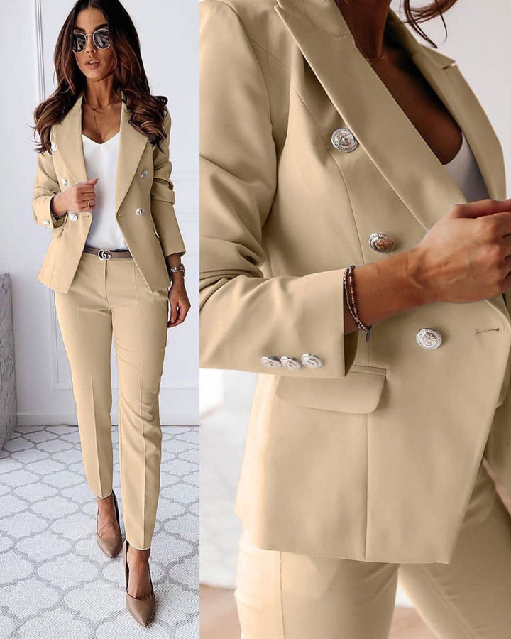 Professional woman wearing a tailored double-breasted suit blazer, elegant business attire fashion.