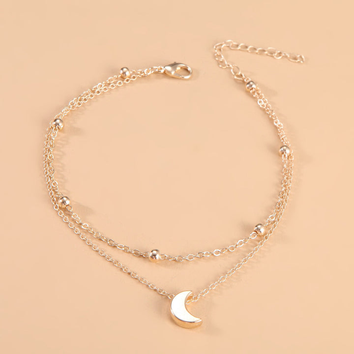 Women's exquisite moon charm anklet, double-layered and adjustable for elegant style.