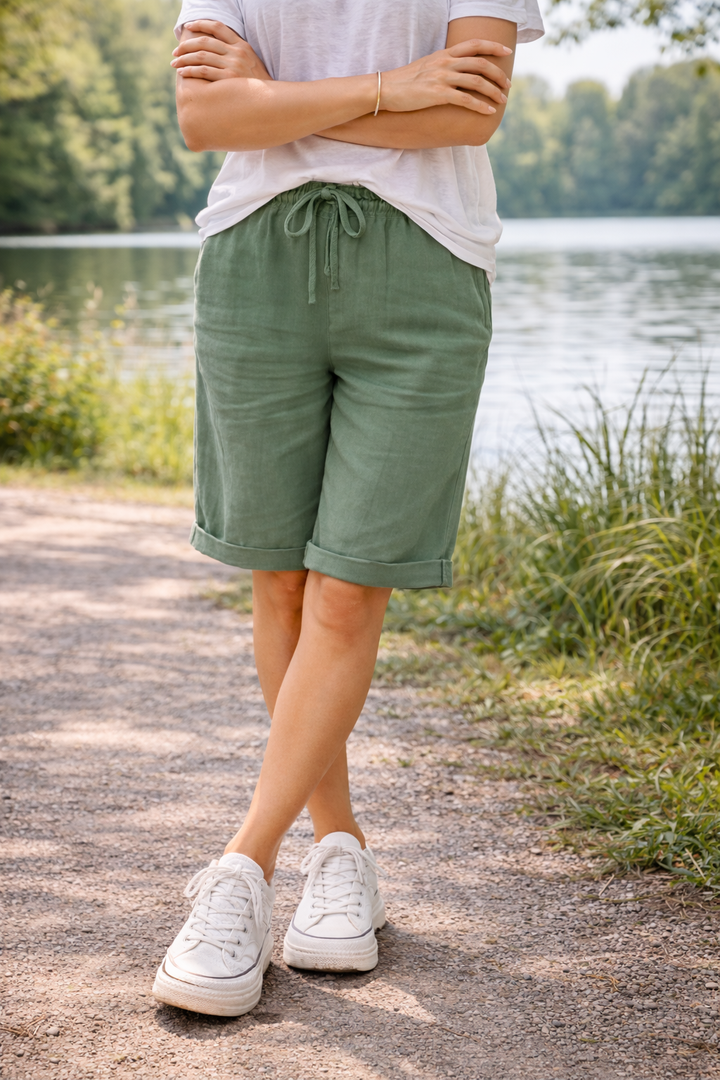 Relaxed fit women's knee-length shorts with adjustable drawstring. Ideal for casual summer fashion & comfort.