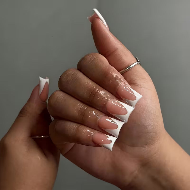 Set of clear duckbill nail tips, artificial press-on nails for easy at-home salon style manicures & nail art.