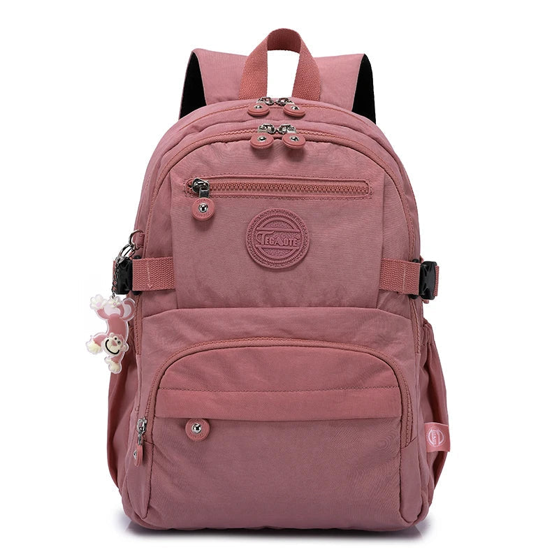 Women's durable water-resistant nylon commuter backpack, front view. Perfect for daily urban carry.