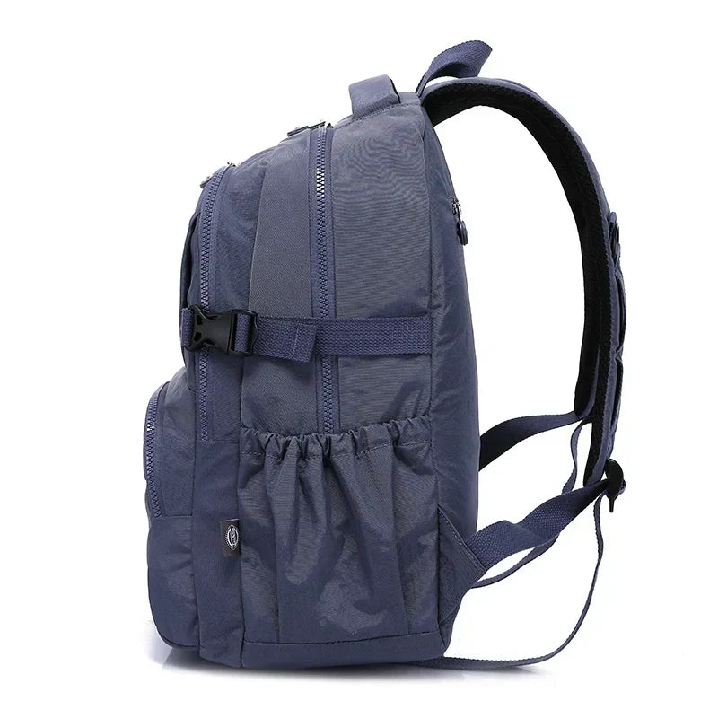 Padded laptop compartment inside a women's water-resistant nylon work backpack.