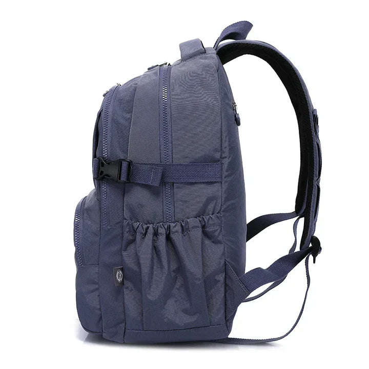Padded laptop compartment inside a women's water-resistant nylon work backpack.