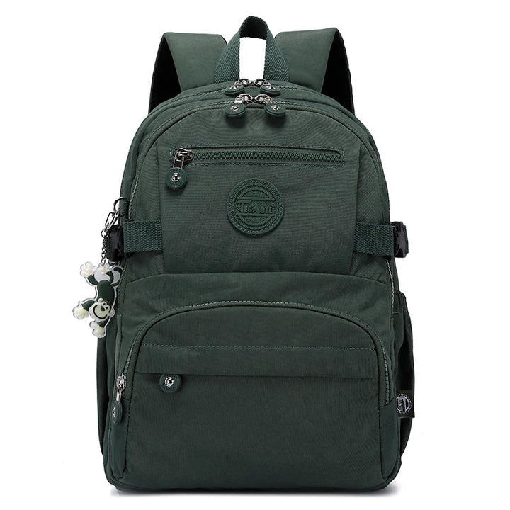 Side view of a water-resistant women's backpack, ideal for school, work & everyday use.