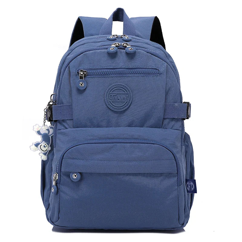 Women's school backpack made from water-resistant nylon, ready for books & essentials.