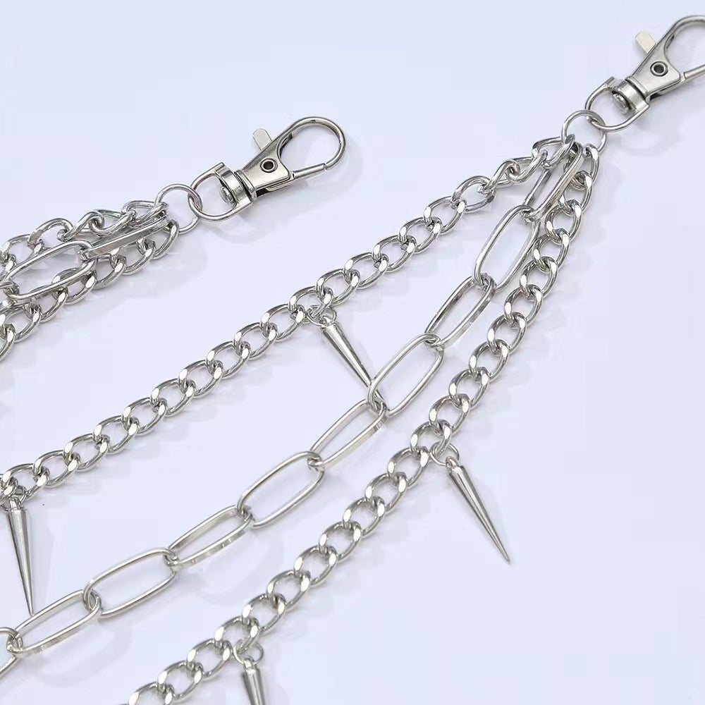 Metallic women's chain belt, detailed with multiple spikes and an adjustable clasp for an edgy fashion statement.