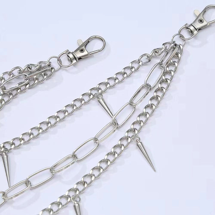 Metallic women's chain belt, detailed with multiple spikes and an adjustable clasp for an edgy fashion statement.
