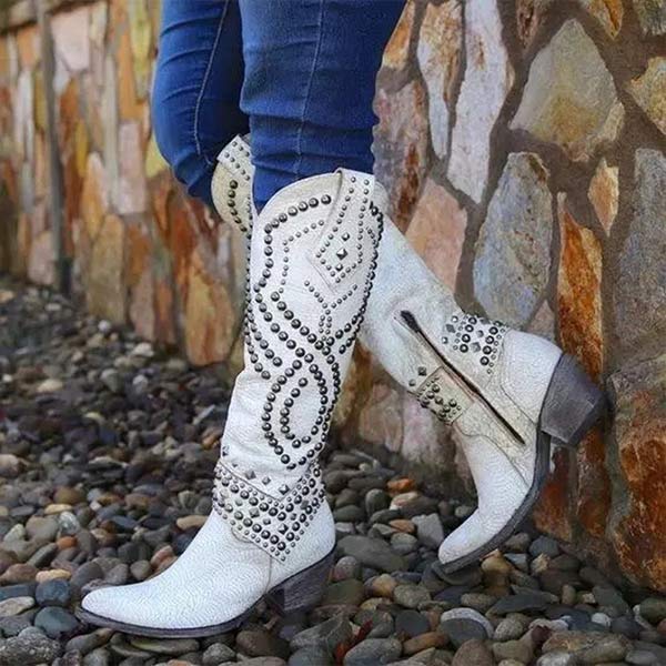 Fashion-forward women's high boots with punk-inspired rivets & a comfortable thick heel. Edgy statement footwear.
