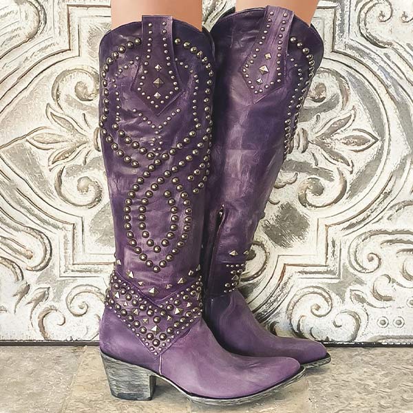 Stylish women's black high boots, featuring edgy rivet accents, a robust thick heel & practical side zipper.