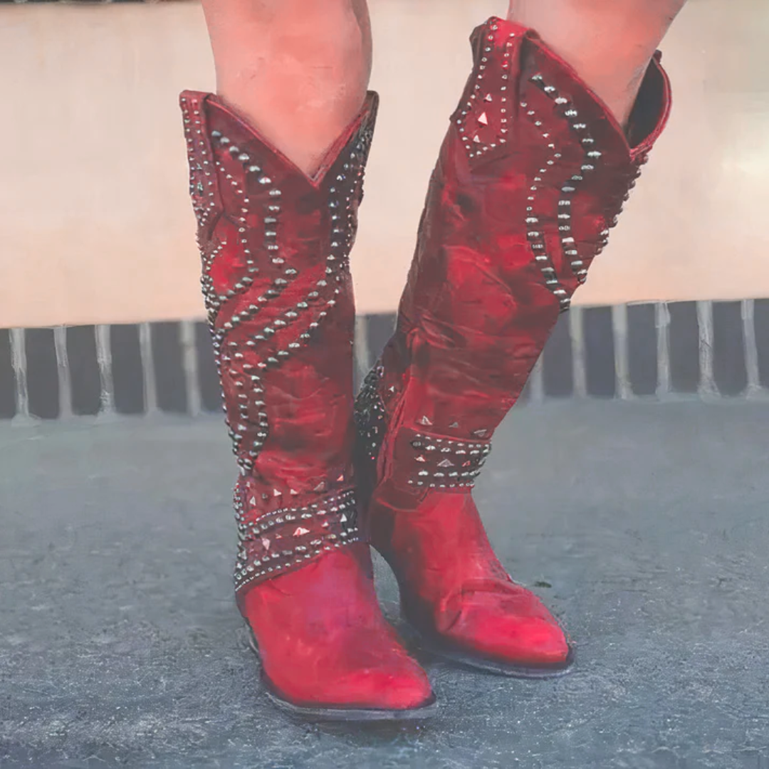 Statement women's high boots: edgy design, prominent rivet detail, and a fashionable thick heel. Side zipper closure.