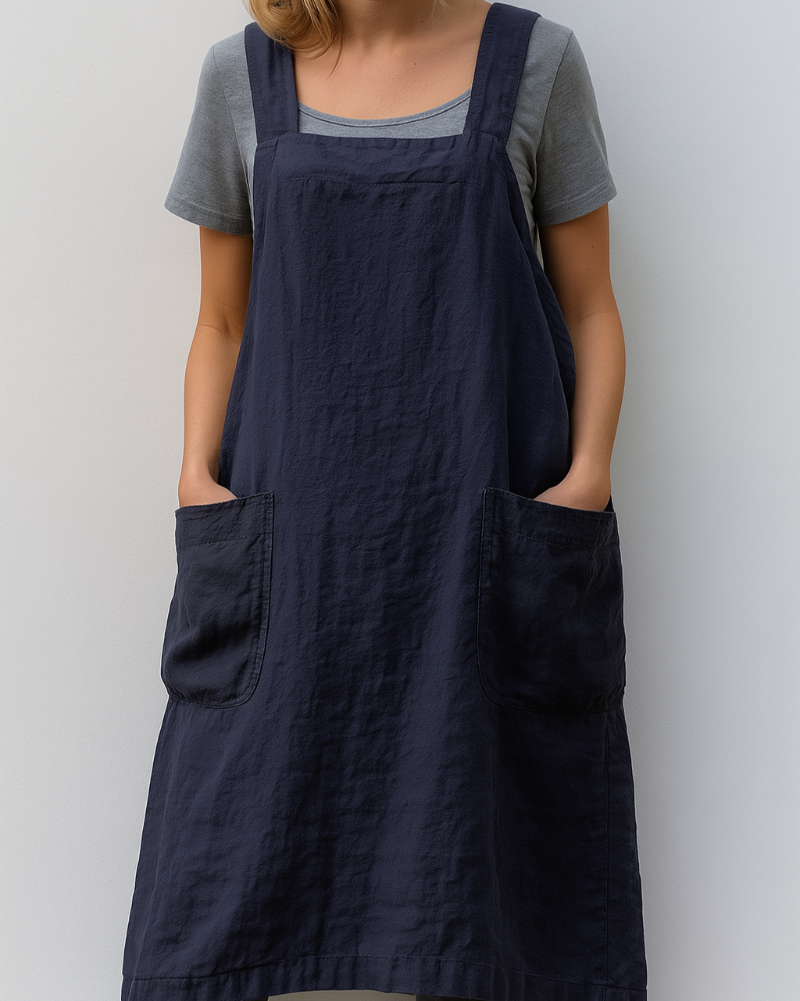 Women's effortless apron dress with practical front pockets, ideal for casual spring & summer comfort.