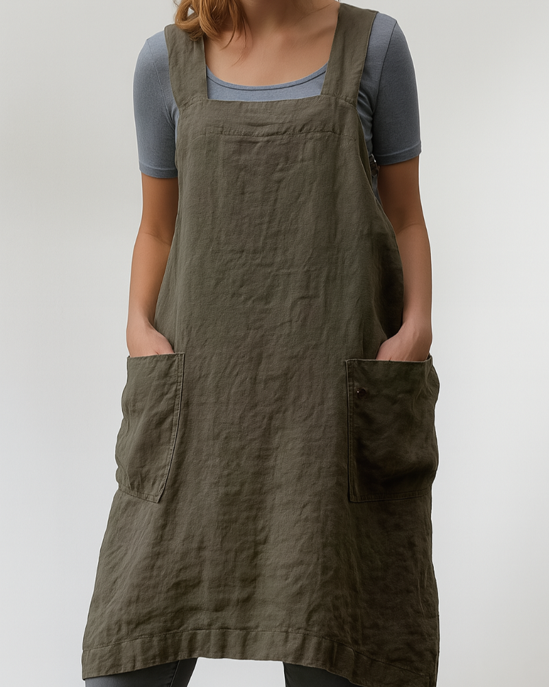 Relaxed women's apron style dress, perfect for comfortable everyday wear. Features functional side pockets.