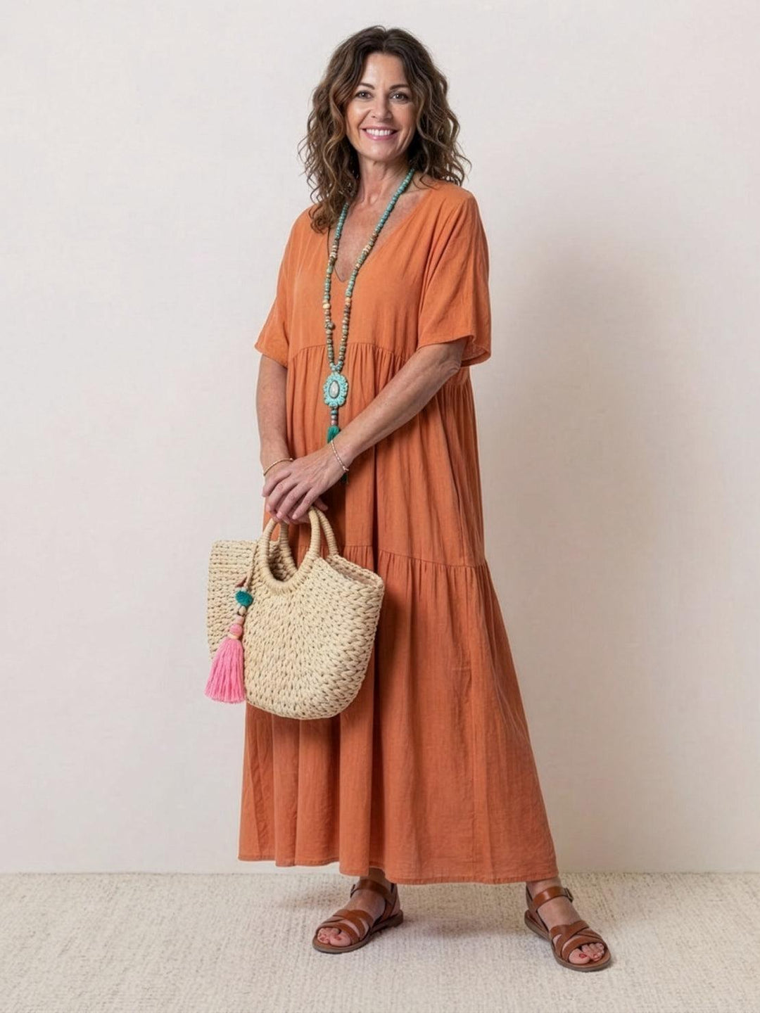 Women's Effortless Boho V-Neck Tiered Maxi Dress. Perfect for summer casual wear.