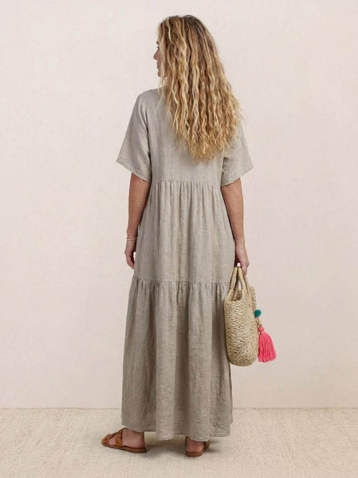 Elegant women's flowy V-neck tiered maxi dress. Perfect for any casual summer event.
