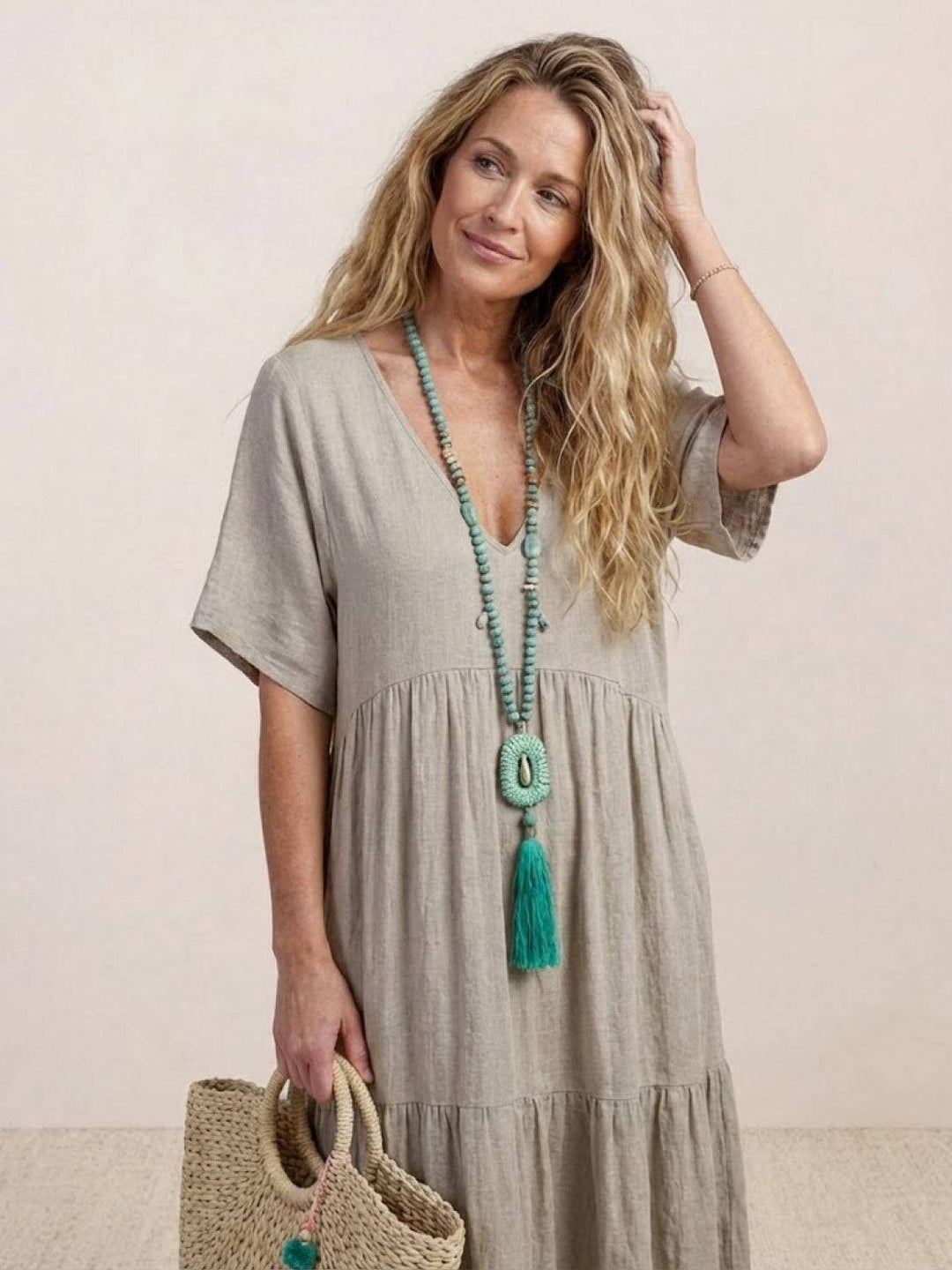 Women's Effortless Boho Maxi Dress. Featuring a V-neck and a comfortable tiered skirt.