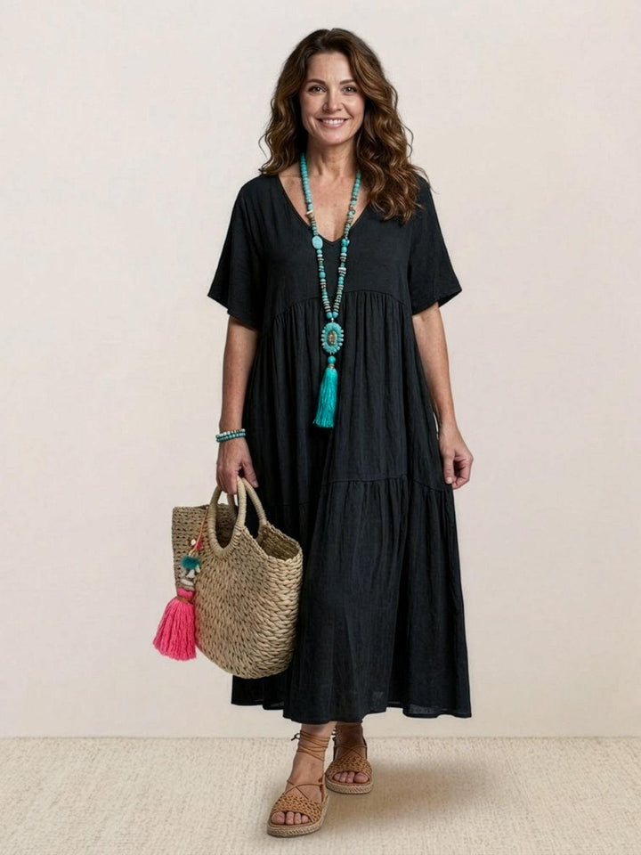 Beach-ready women's boho V-neck tiered maxi dress. Comfortable and stylish.
