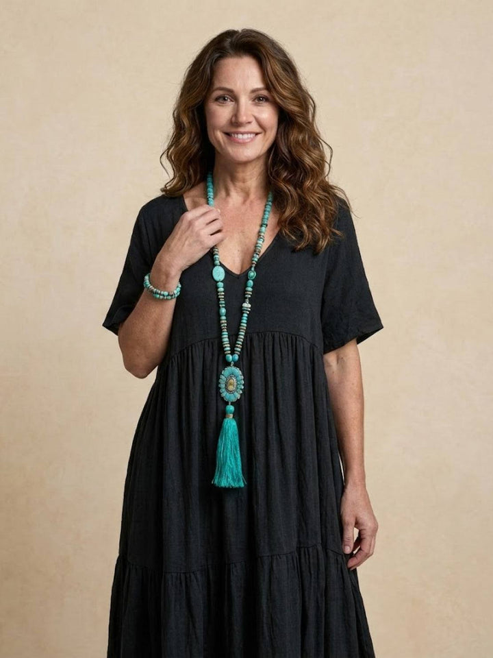 Comfortable women's flowy tiered maxi dress. Perfect V-neck design for warm weather.