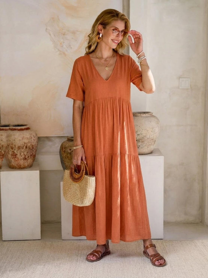 Flowy V-neck tiered maxi dress for women. Ideal comfortable vacation or beach wear.