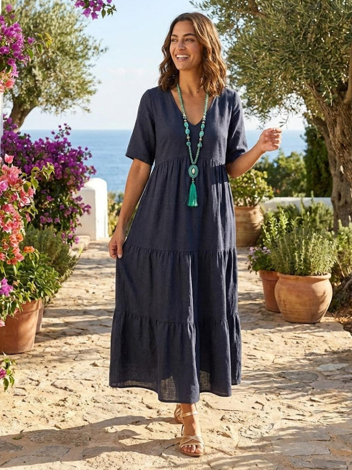 Summer fashion women's V-neck tiered maxi dress. Effortless boho elegance.