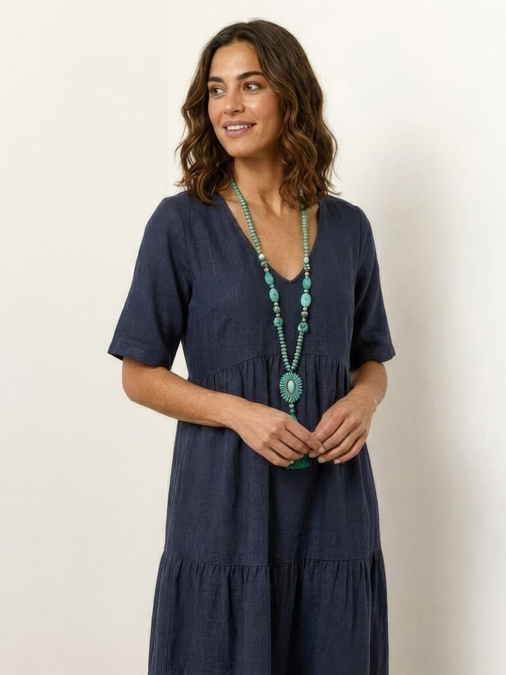 Flowy women's casual tiered maxi dress. V-neck boho style, great for vacation.