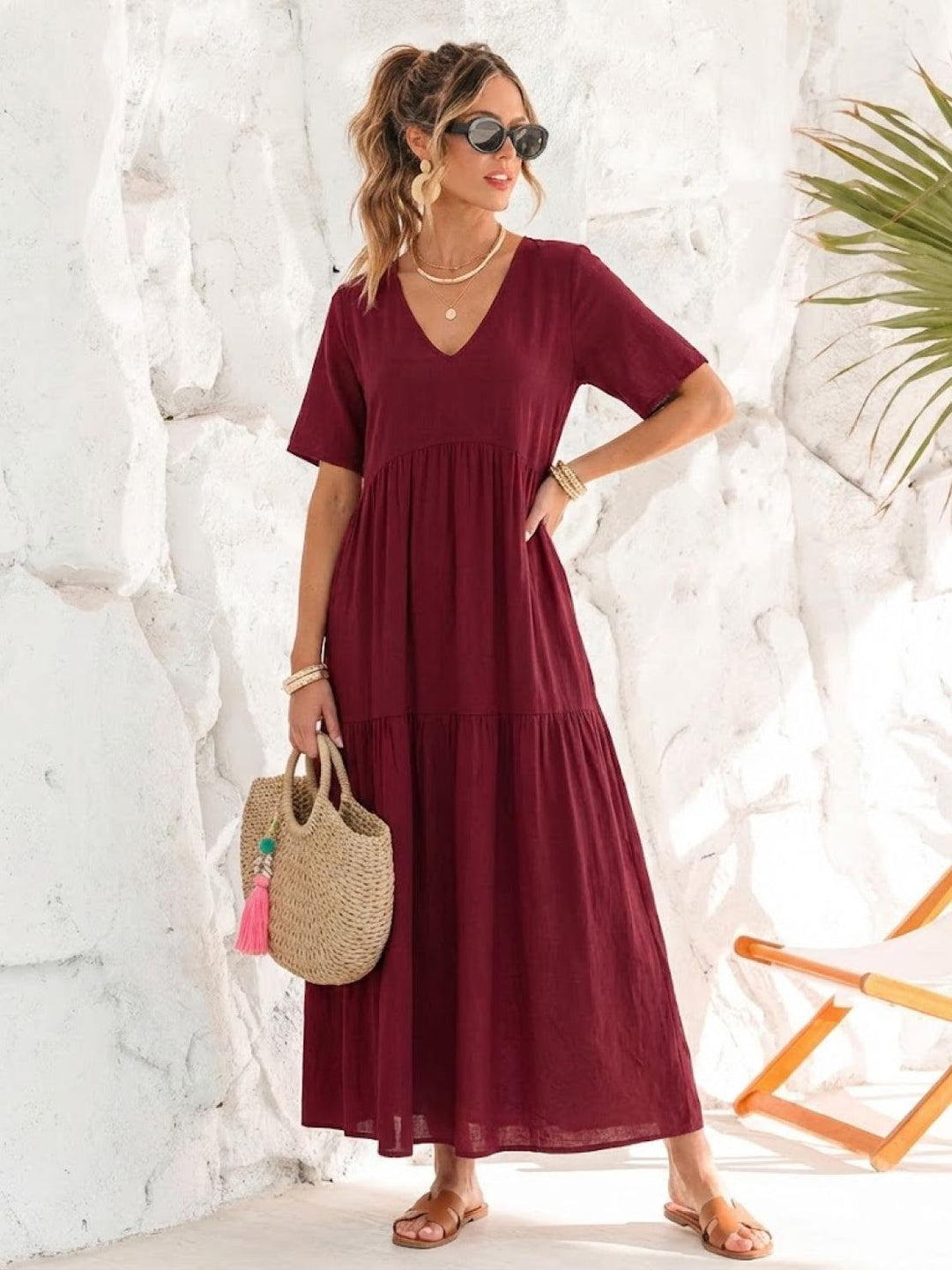 Women's comfortable tiered maxi dress. V-neck boho design, ideal for summer days.