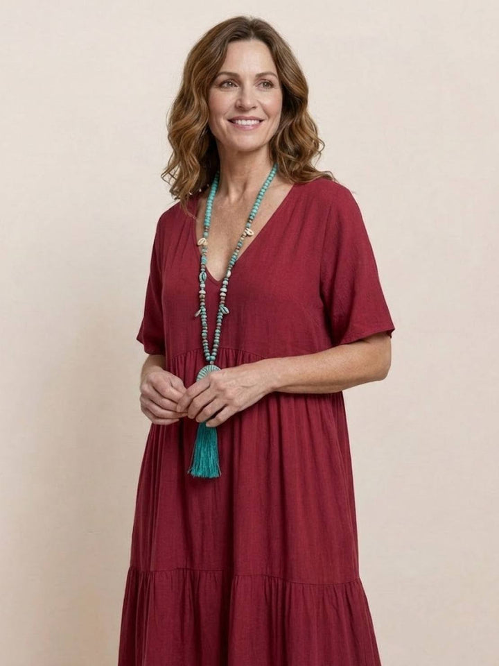 Casual women's summer V-neck tiered maxi dress. Effortless boho elegance.