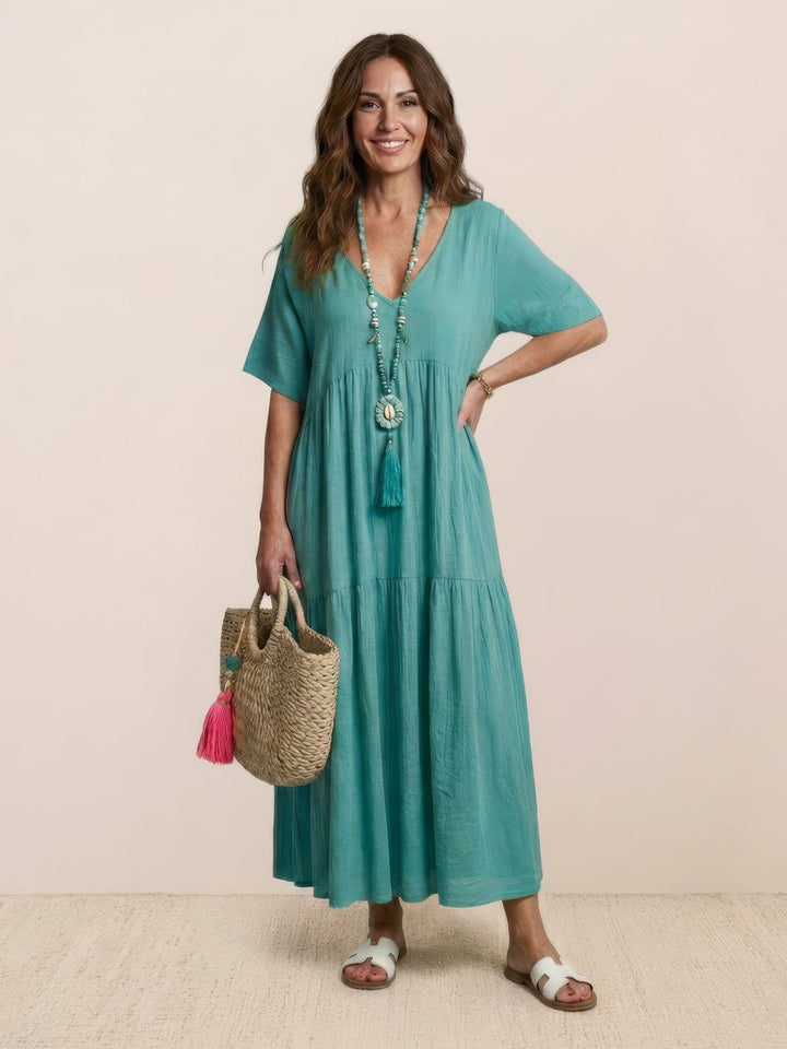 Women's effortless boho V-neck tiered maxi dress. A versatile piece for summer.