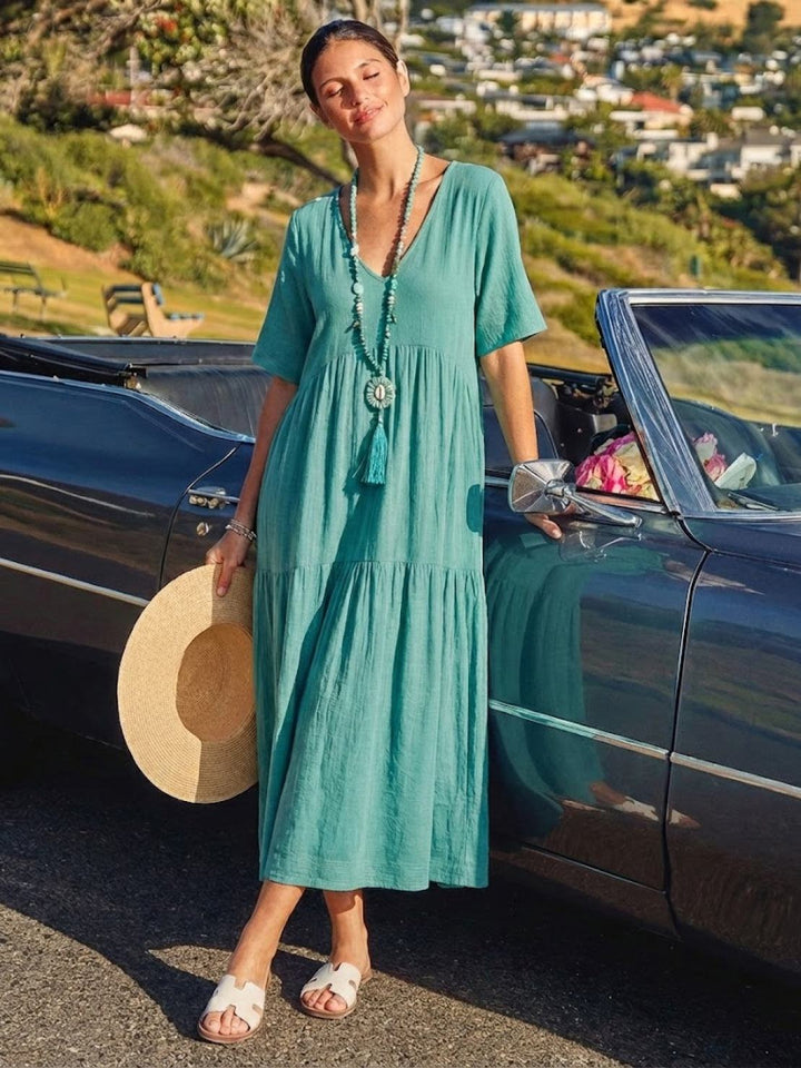Women's beach maxi dress. Flowy V-neck tiered boho design for ultimate comfort.