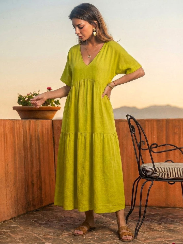 Effortless women's summer day dress. Boho V-neck tiered maxi style for relaxation.