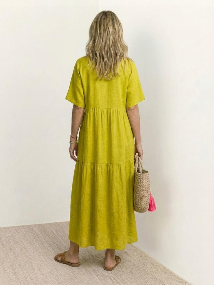 Stylish women's tiered maxi dress. V-neck boho design, great for summer casual.