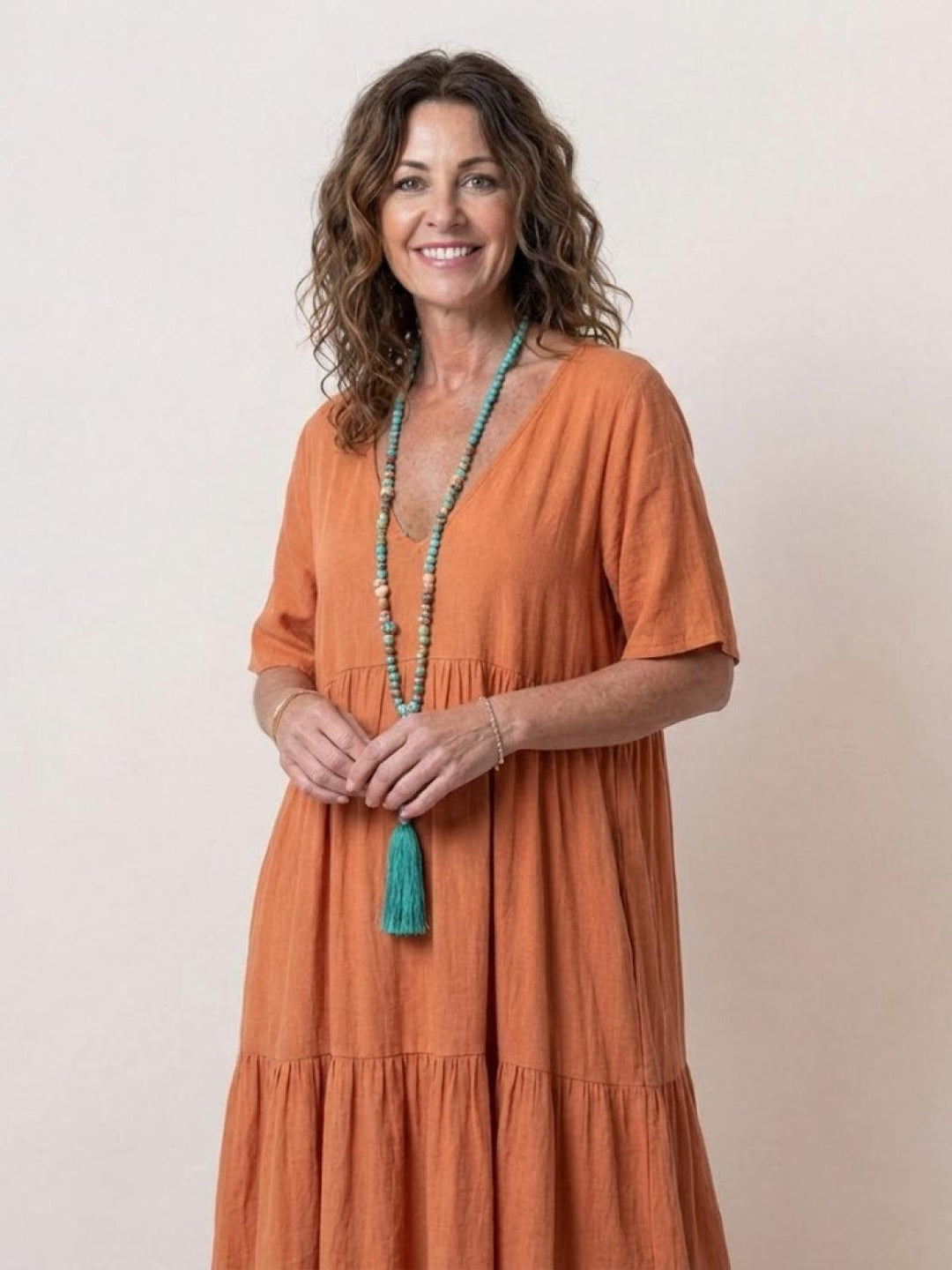 Stylish women's boho V-neck tiered maxi dress. Perfect for beach or casual outings.