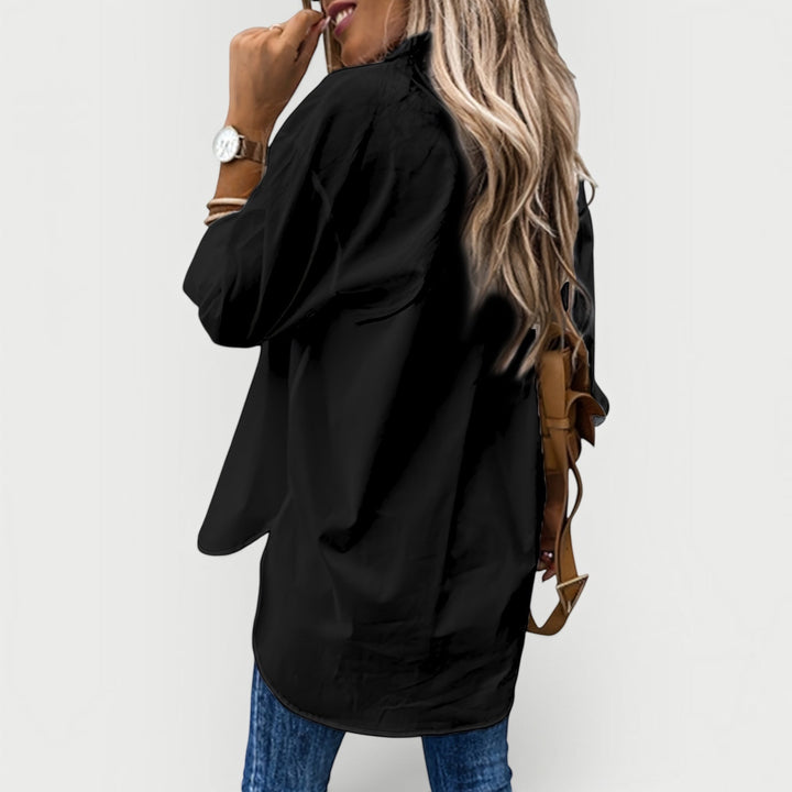 Classic women's button-front blouse, a versatile staple for any casual or office ensemble.