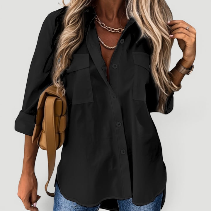 Close-up of a women's button-down blouse, highlighting its soft fabric & elegant design.