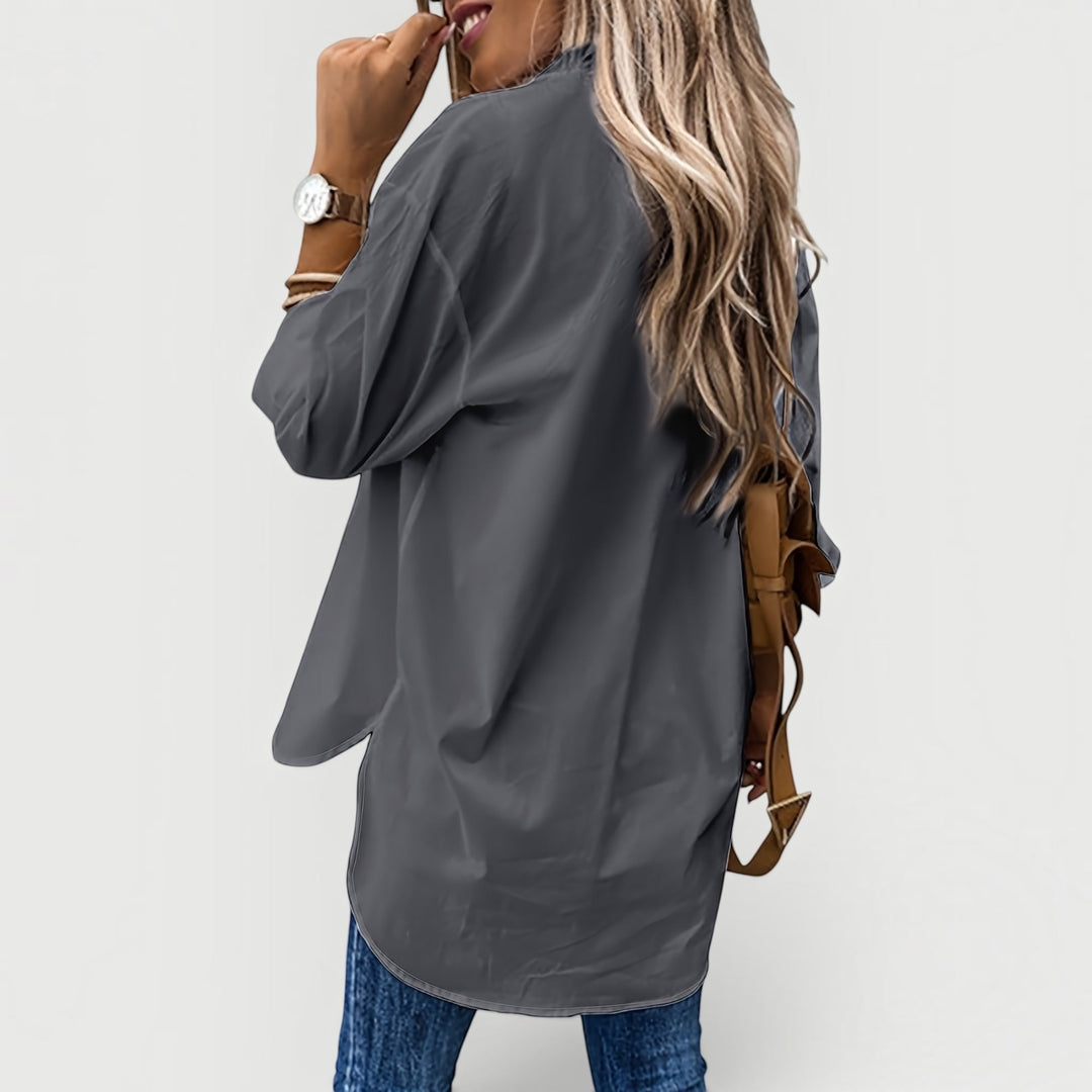 Chic women's workwear blouse with front buttons, offering a polished & comfortable look.